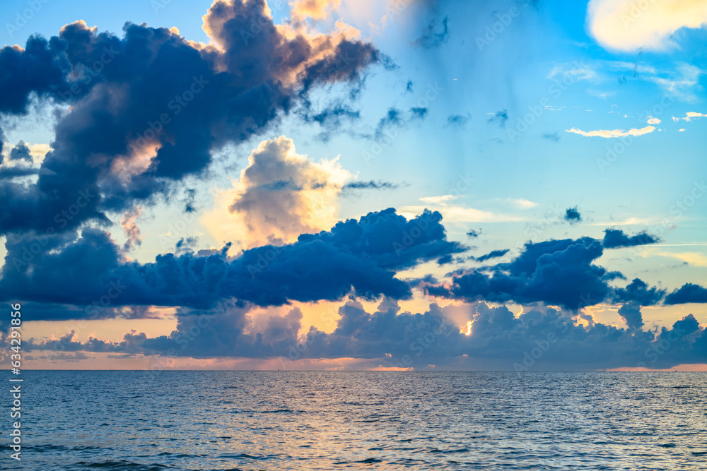 Sunrise sea on tropical beach. Landscape of beautiful beach. Beautiful sunset at sea. Colorful ocean beach sunrise. Ocean sunset on sky background with colorful clouds.