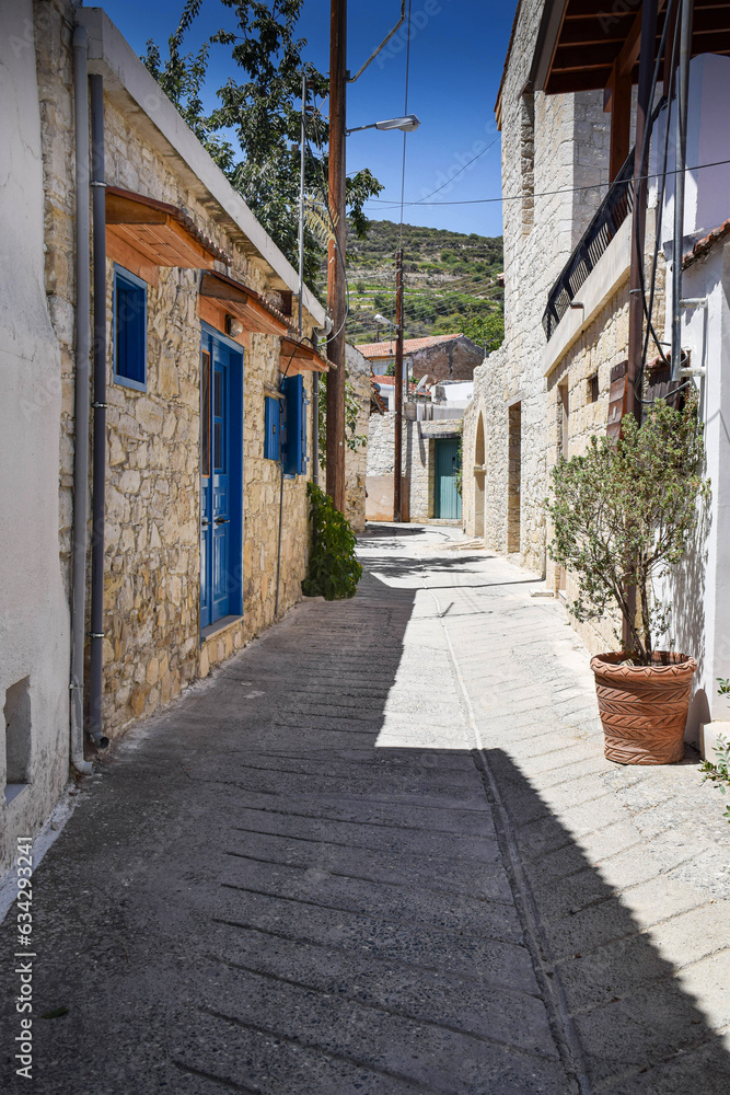 Street view in the old town with old colored houses and cobbled road on a summer sunny day. Beautiful architecture on the island of Cyprus
