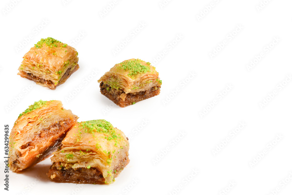 Pistachio baklava on a white background. Dessert. Pistachio baklava on a white background. Dessert.