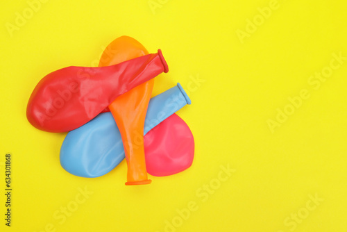 colored balloons on a yellow background
