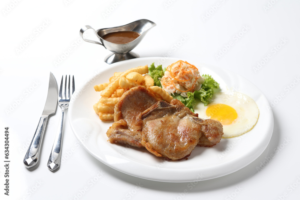 grilled golden bbq chicken chop pork cutlet beef steak with fried egg, French fries, coleslaw salad and black pepper sauce on brown leather white background western chef halal food restaurant menu grilled golden bbq chicken chop pork cutlet beef steak with fried egg, French fries, coleslaw salad and black pepper sauce on brown leather white background western chef halal food restaurant menu