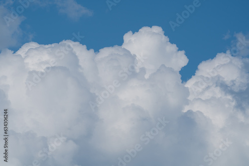 white fluffy clouds standing out against a blue sky