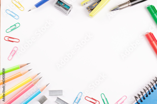 Top view of office supplies on white background with copy space for advertisement