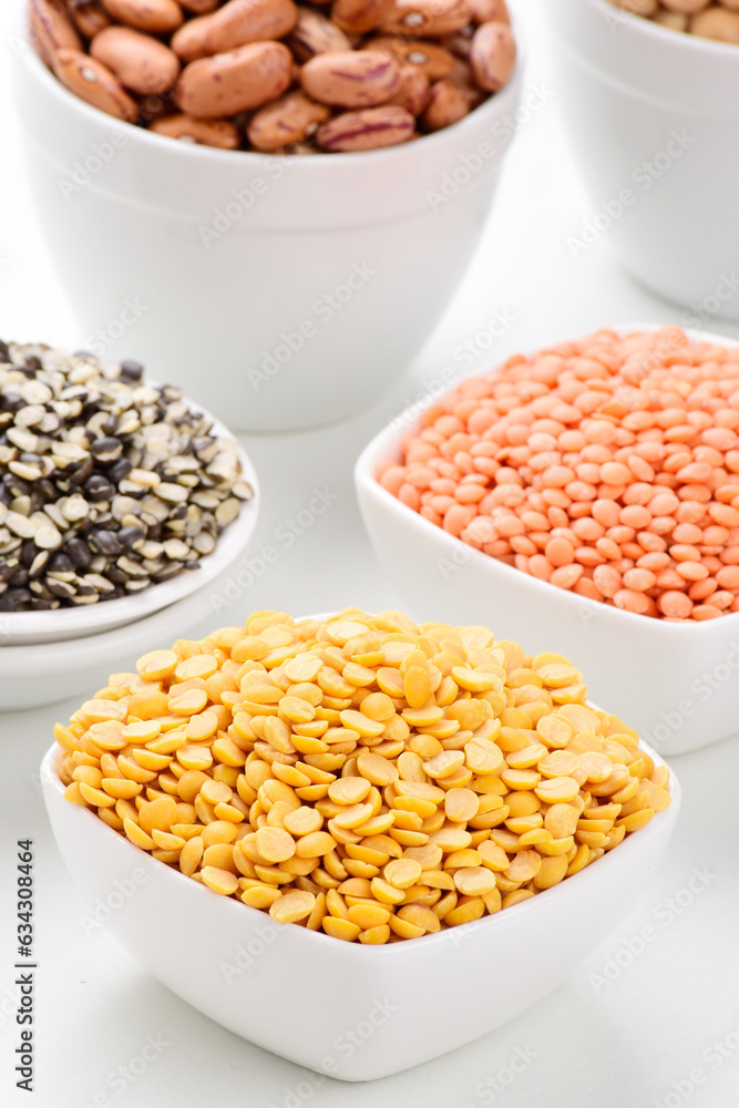 Raw chana dal in bowl on white background Raw chana dal in bowl on white background