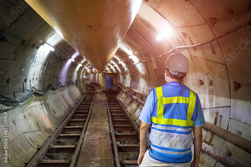 Soft focus and blurred lighting background of focus at engineer or technician control. Underground tunnel infrastructure. Transport pipeline by Tunnel Boring Machine for electric train subway photo