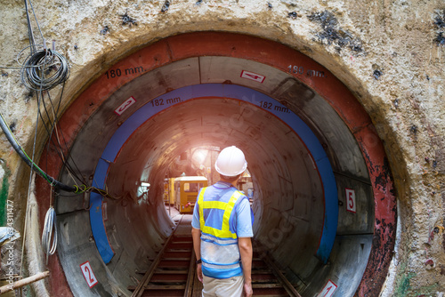 Soft focus and blurred lighting background of focus at engineer or technician control. Underground tunnel infrastructure. Transport pipeline by Tunnel Boring Machine for electric train subway