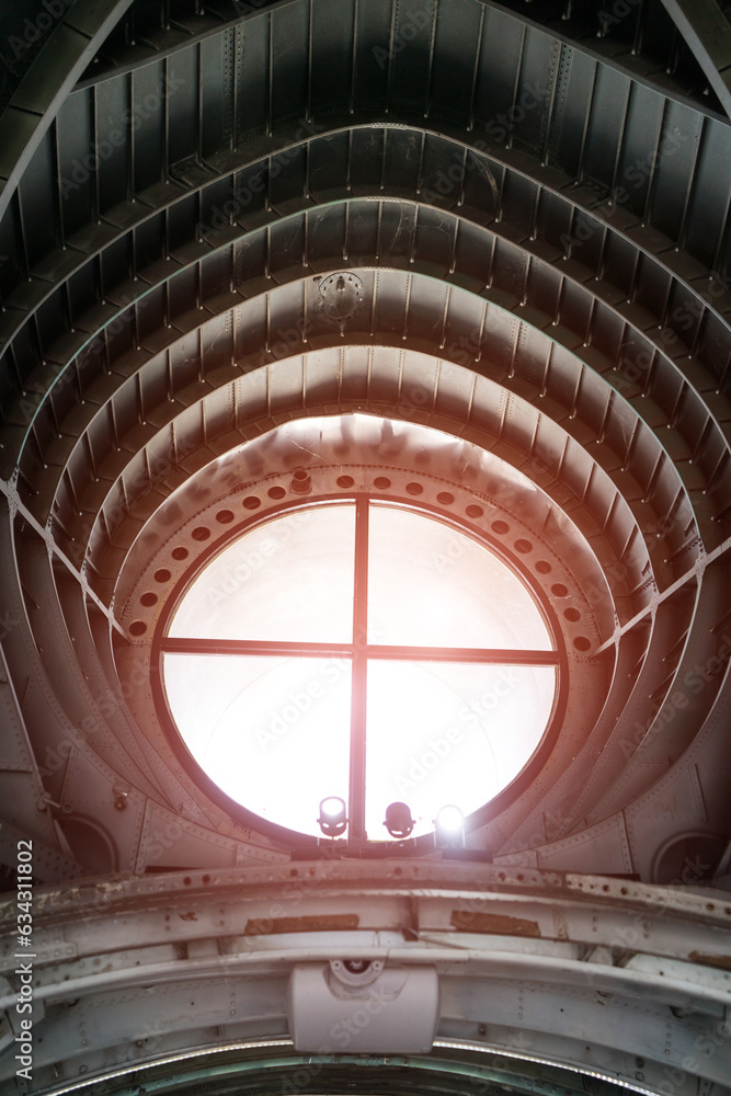 Circle glass of light box with Arched roof steel structure the design for framework look like tunnel. building roof carcass .Old architectural iron Circle glass of light box with Arched roof steel structure the design for framework look like tunnel. building roof carcass .Old architectural iron