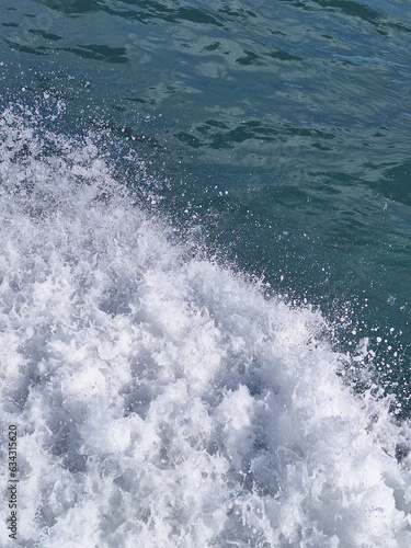 splashng of waterf from boat in the sea photo