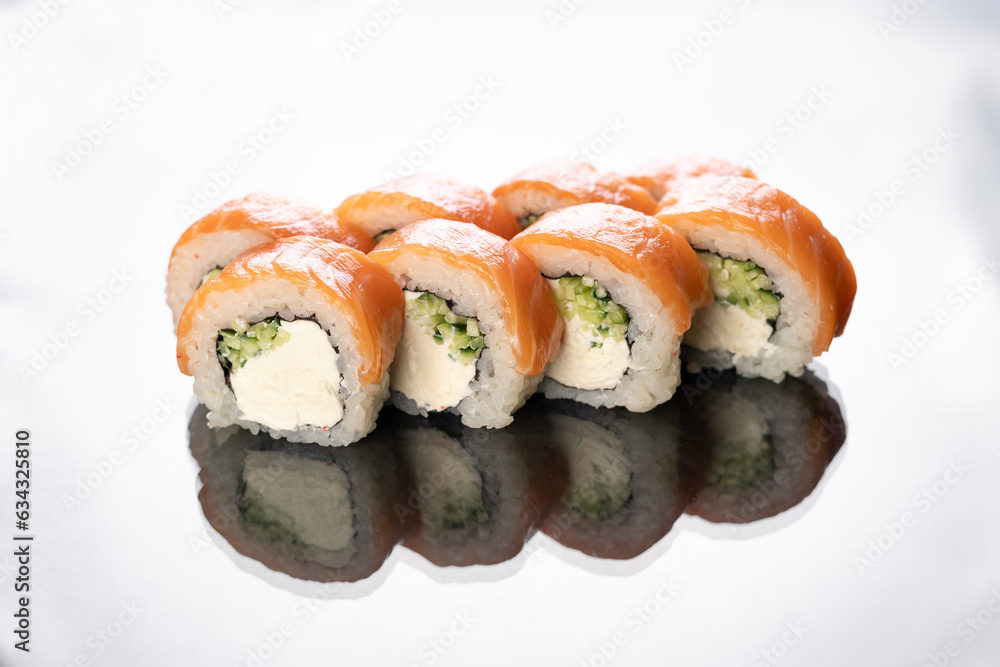Philadelphia sushi roll isolated on white background with reflection Philadelphia sushi roll isolated on white background with reflection