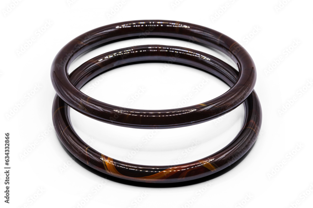 two old bangle bracelet has brown wooden pattern isolated on white background,macro photo,has path two old bangle bracelet has brown wooden pattern isolated on white background,macro photo,has path