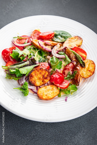 potato salad baked vegetable potato, tomato, onion, salad leaves vegetables food healthy meal food snack on the table copy space food background rustic top view 