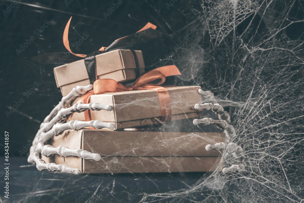 Halloween and waste-free production, eco-friendly gift wrapping in kraft paper on a dark table, eco-style Halloween holiday concept, eco-decorated banner