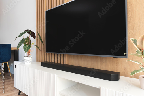 Soundbar in a modern home. Listening to music