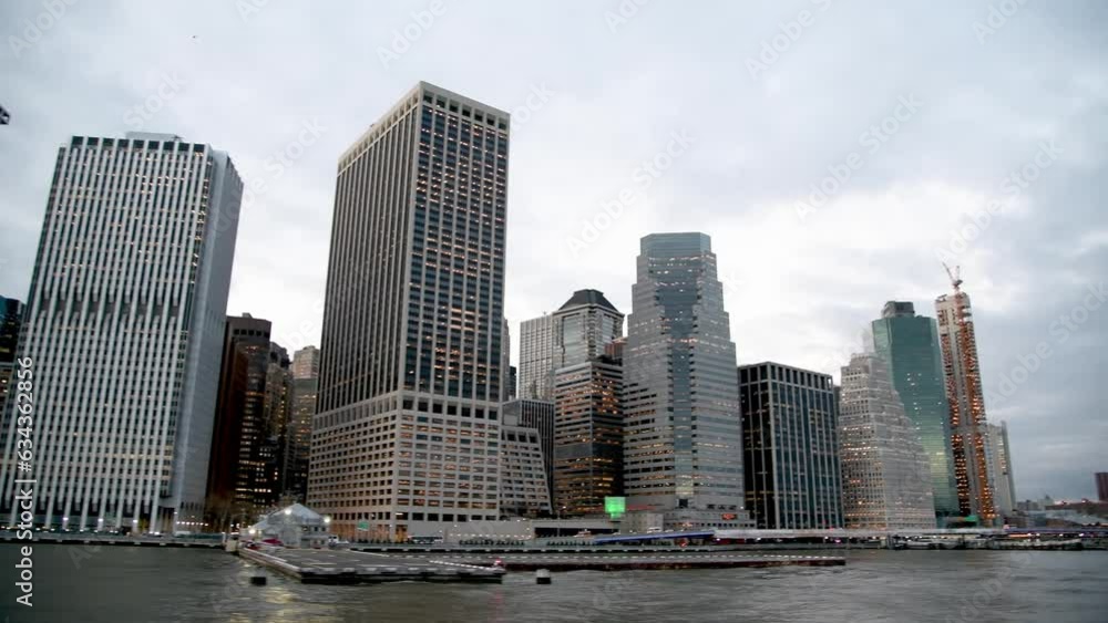 Modern skyline of Lower Manhattan from a moving boat on the Hudson River Modern skyline of Lower Manhattan from a moving boat on the Hudson River
