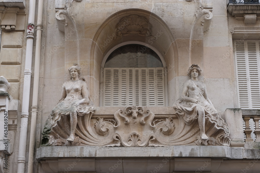 Fancy ornament details and decorations shot on Paris building facades. Doors and windows surround, decorated balconies.