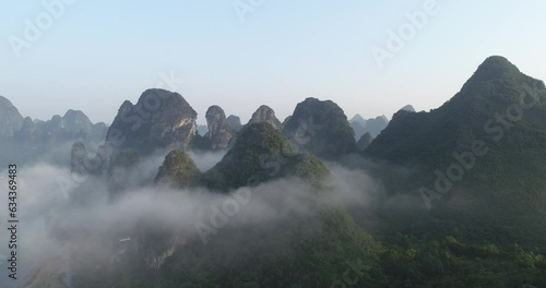 The natural scenery of karst mountain peaks in the morning fog in Xingping Town, Yangshuo County, Guilin, Guangxi, China