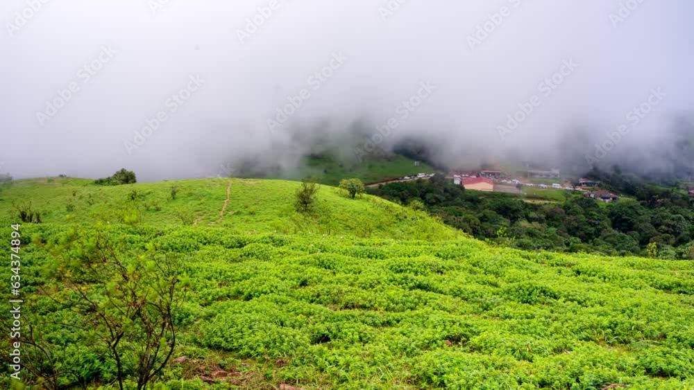 Timelapse view of Western ghats mountain range seen from Devaramane Peak, Karnataka, India. Timelapse view of Western ghats mountain range seen from Devaramane Peak, Karnataka, India.