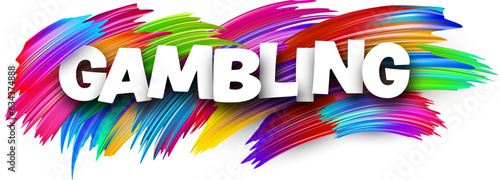 Gambling paper word sign with colorful spectrum paint brush strokes over white. Vector illustration.