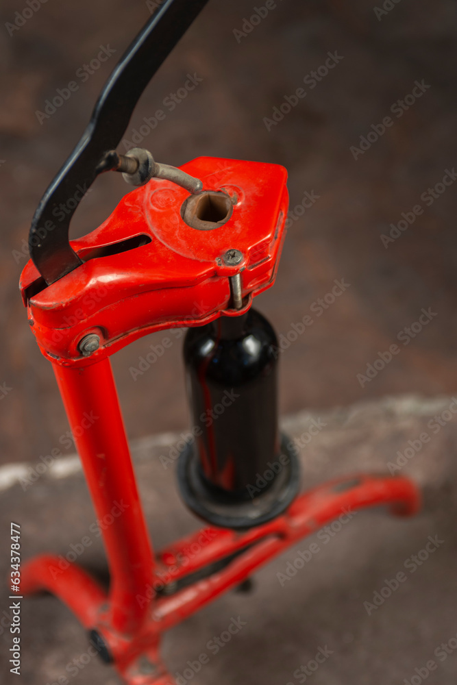 close-up of a man corking a bottle of wine at a winery close-up of a man corking a bottle of wine at a winery