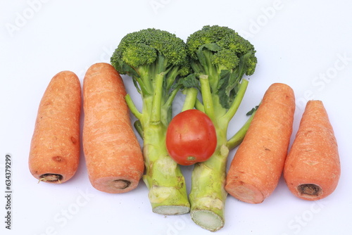 carrots, tomatoes and broccoli isolated on white background