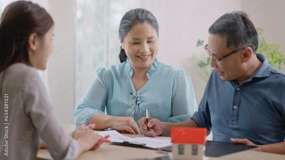 Happy senior old family asian couple clients make financial insurance estate business deal handshake agent lawyer, atisfied mature customers shake hand meeting bank manager agree on investment contrac Happy senior old family asian couple clients make financial insurance estate business deal handshake agent lawyer, atisfied mature customers shake hand meeting bank manager agree on investment contrac