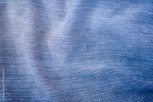abstract background of old blue denim close up