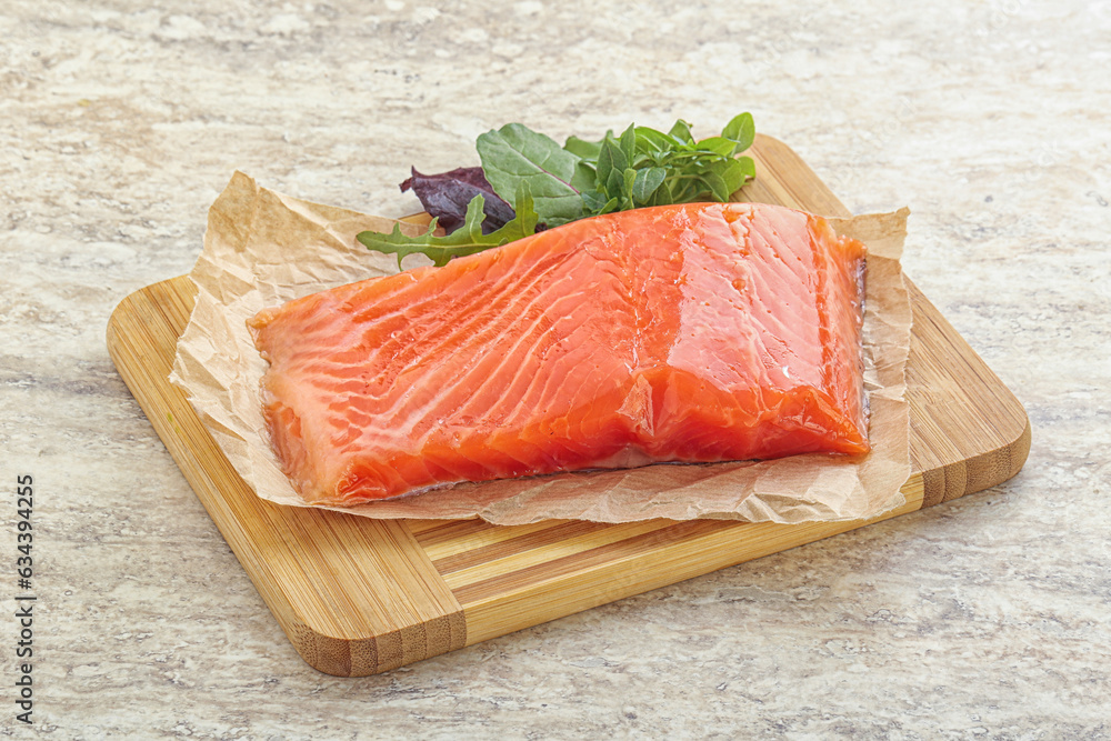 Raw salmon fillet over board Raw salmon fillet over board