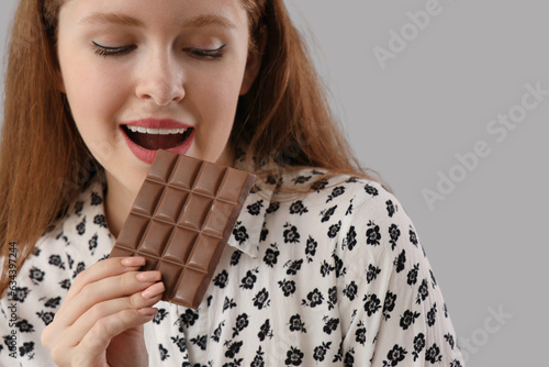 Young woman eating tasty ch...