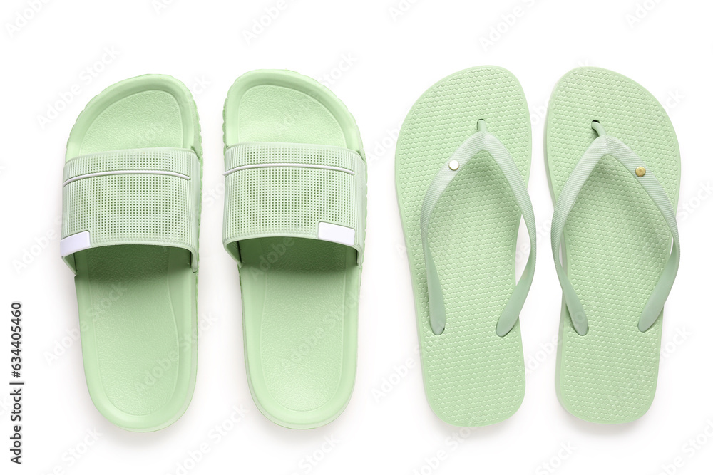 Colorful pairs of female flip flops on white background Colorful pairs of female flip flops on white background