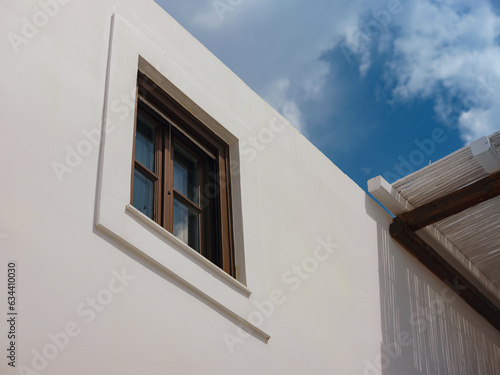 travel to city of Lindos on island of Rhodes, Greece. Details of streets of old town Lindos. Interesting elements of door, shutters, bas-relief of walls. tourist attraction on island of Rhodes