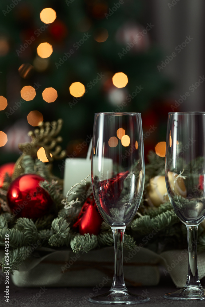 festive table on the background of a fir tree with a bokeh christmas and New Year's concept, interior details, selective focus festive table on the background of a fir tree with a bokeh christmas and New Year's concept, interior details, selective focus