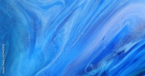 Blue background with unique moving streaks of blue, white, lilac tones. Abstract art. Marble texture.