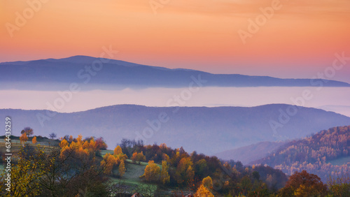 carpathian mountain landscape in autumn. beautiful countryside scenery. foggy sunrise