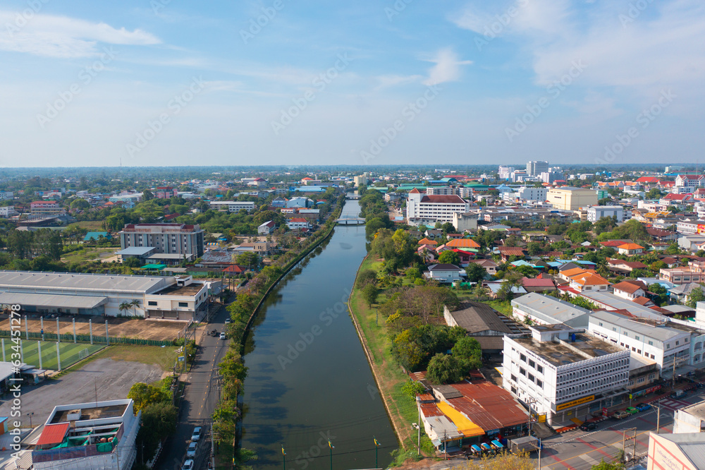 Aerial view of residential neighborhood roofs. Urban housing development from above. Top view. Real estate in Roi et province city, Thailand. Property real estate.