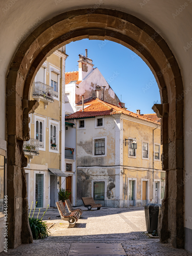 Picturesque archway and houses in Alcobaca, Portugal