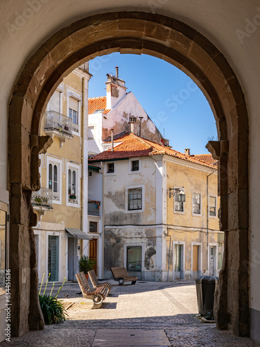 Picturesque archway and houses in Alcobaca, Portugal © reisezielinfo