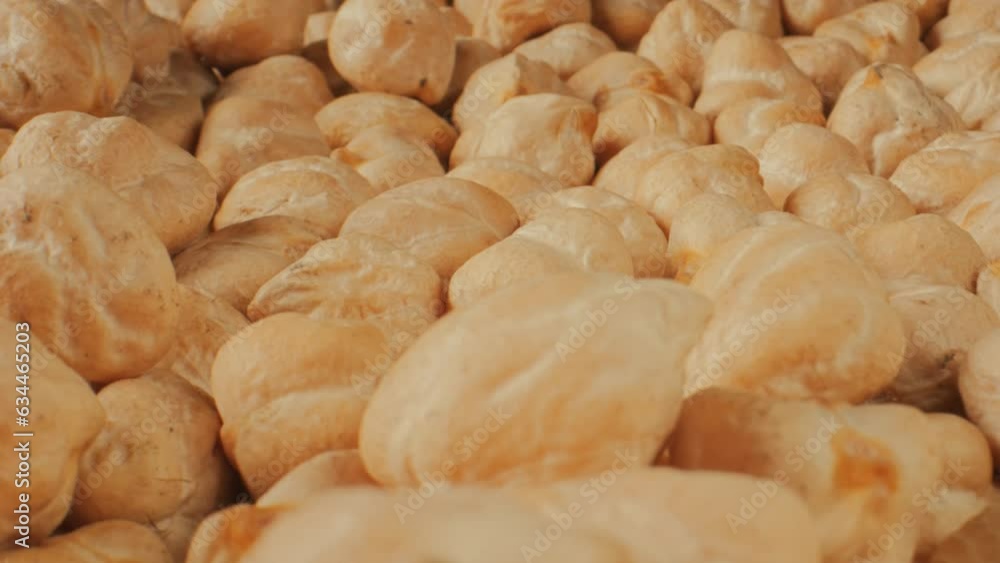Chickpeas close-up. Chickpea seeds slow motion. Cicer arietinum. Macro footage of chickpeas beans. Raw chickpeas rotation. Chickpeas close-up. Chickpea seeds slow motion. Cicer arietinum. Macro footage of chickpeas beans. Raw chickpeas rotation.