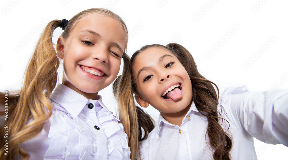 back to school. girls children having selfie time. school friends blogging and taking selfie with phone. school children making selfie in classroom. friendly portrait of kids back to school. girls children having selfie time. school friends blogging and taking selfie with phone. school children making selfie in classroom. friendly portrait of kids