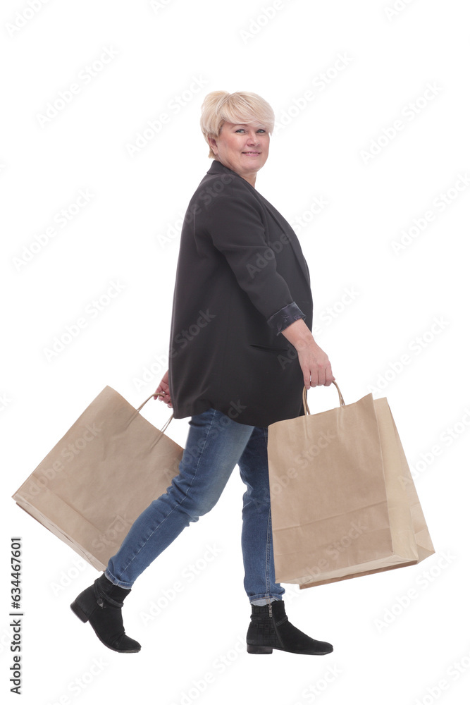 full-length. casual mature woman with shopping bags . full-length. casual mature woman with shopping bags .