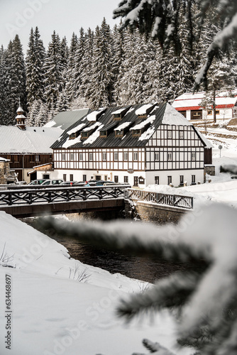Winter Modrava and old historical building with wooden bridge, Sumava mountains
