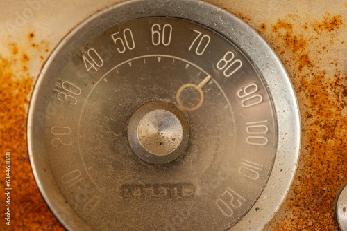 Old rusty odometer with poiner on 80mph photo