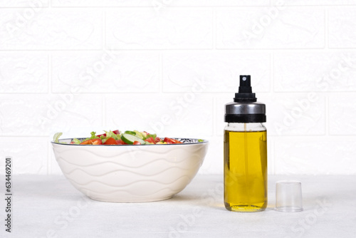 Salad bowl and olive oil
