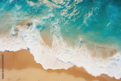 Sandy beach, turquoise ocean and waves, top view, summer landscape