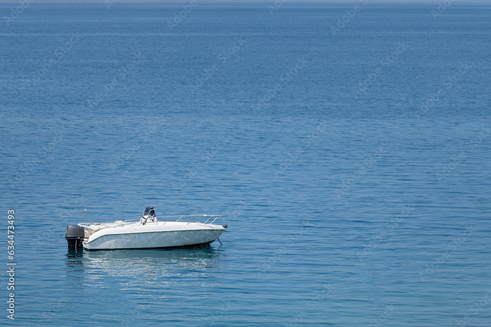 Lonely boat on the blue sea, seascape Lonely boat on the blue sea, seascape