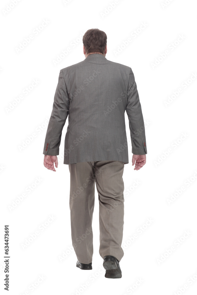 full-length. casual man in a grey jacket striding forward. full-length. casual man in a grey jacket striding forward.