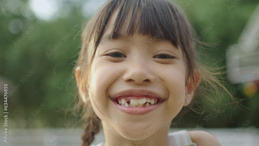 Young Asian girl smiling and laughing. Young Asian girl smiling and laughing.