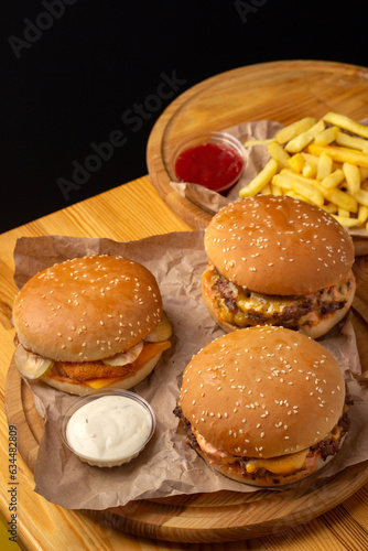 Wallpaper Mural a set of three burgers, two sauces and french fries. Street food. Fast food. Menu for street cafe, fast food restaurant. Torontodigital.ca