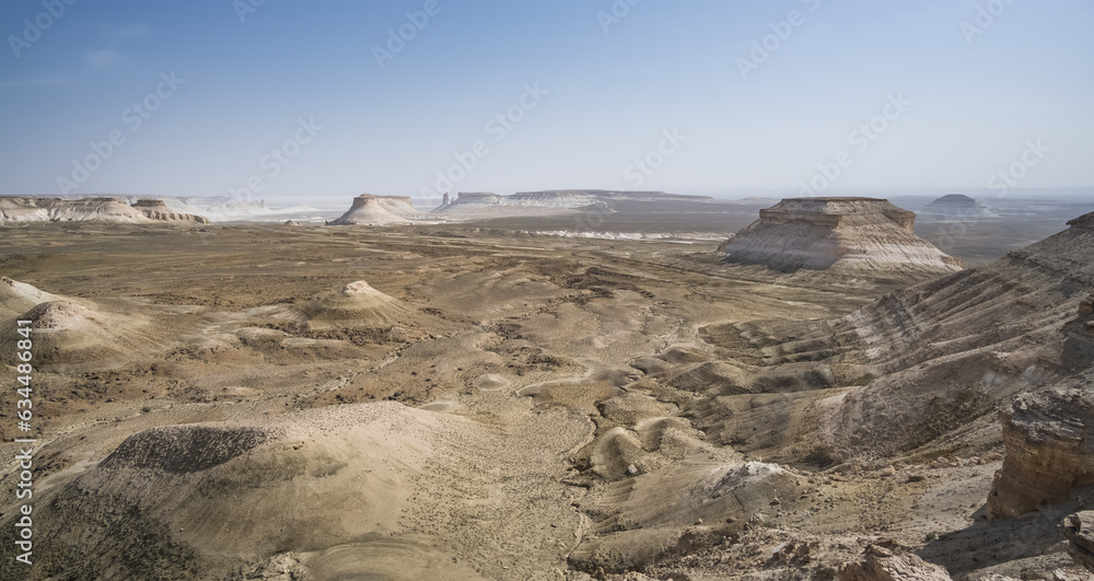 Panorama of hills and ridges with limestone and chalk slopes in the Kazakh steppe, relief folds in the desert tract of Boszhira