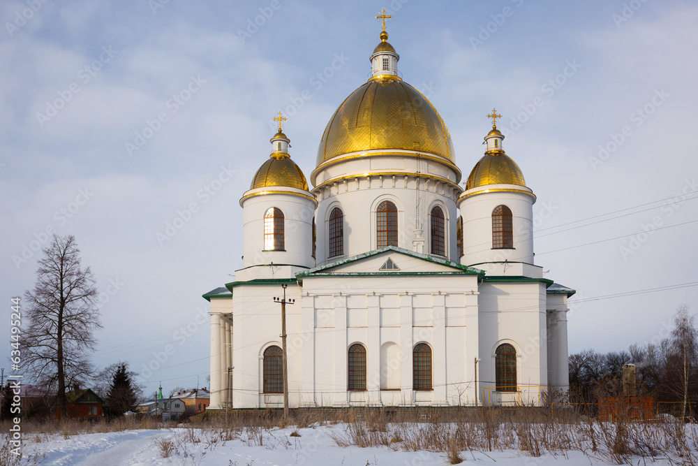 Majestic building of Trinity Cathedral with golden domes in Russian town of Morshansk on winter day.