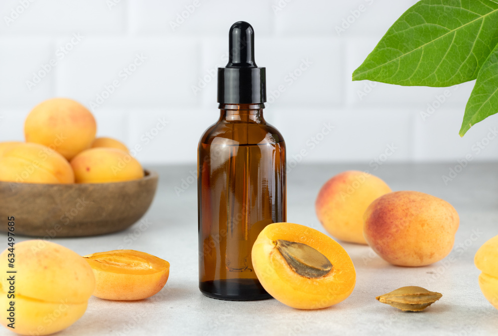 Apricot oil and fresh apricots in a brown bottle. Natural cosmetic. Apricot oil and fresh apricots in a brown bottle. Natural cosmetic.